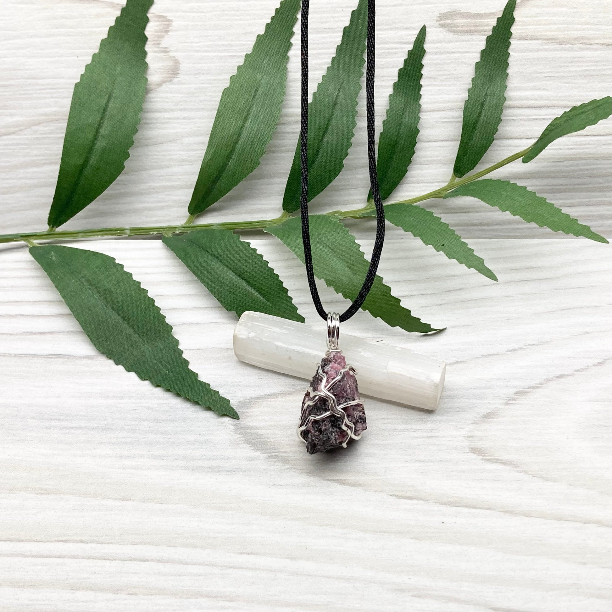 Rhodonite necklace. Raw Rhodonite wrapped with silver copper wire. Comes on a black chain. Black and pink crystal pendant. Wire wrapped stone jewelry. Taurus zodiac gift.