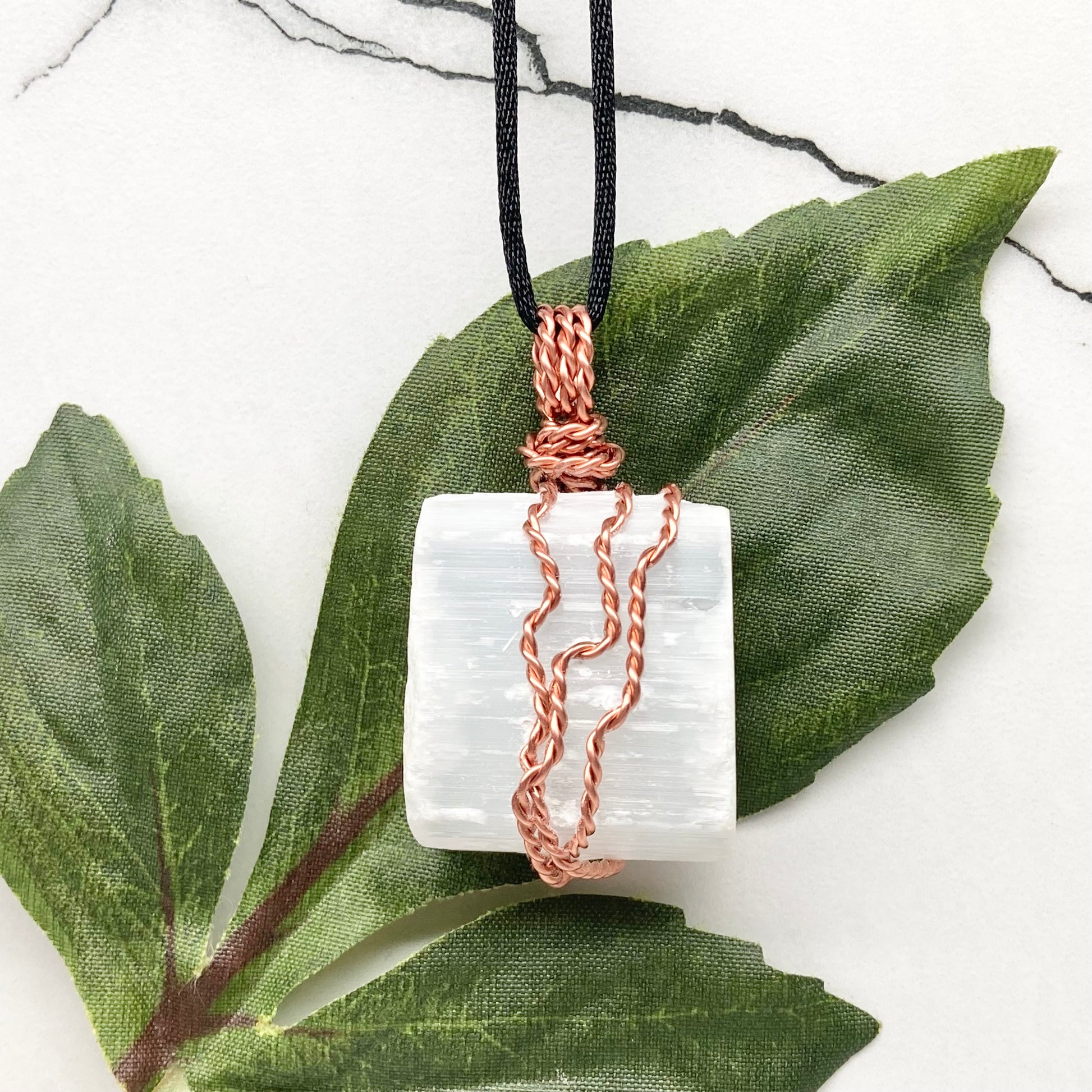 Large chunky Selenite crystal wrapped in 99.9% pure copper wire on a black necklace. Big white stone pendant. Handmade during the Moon in Aries.