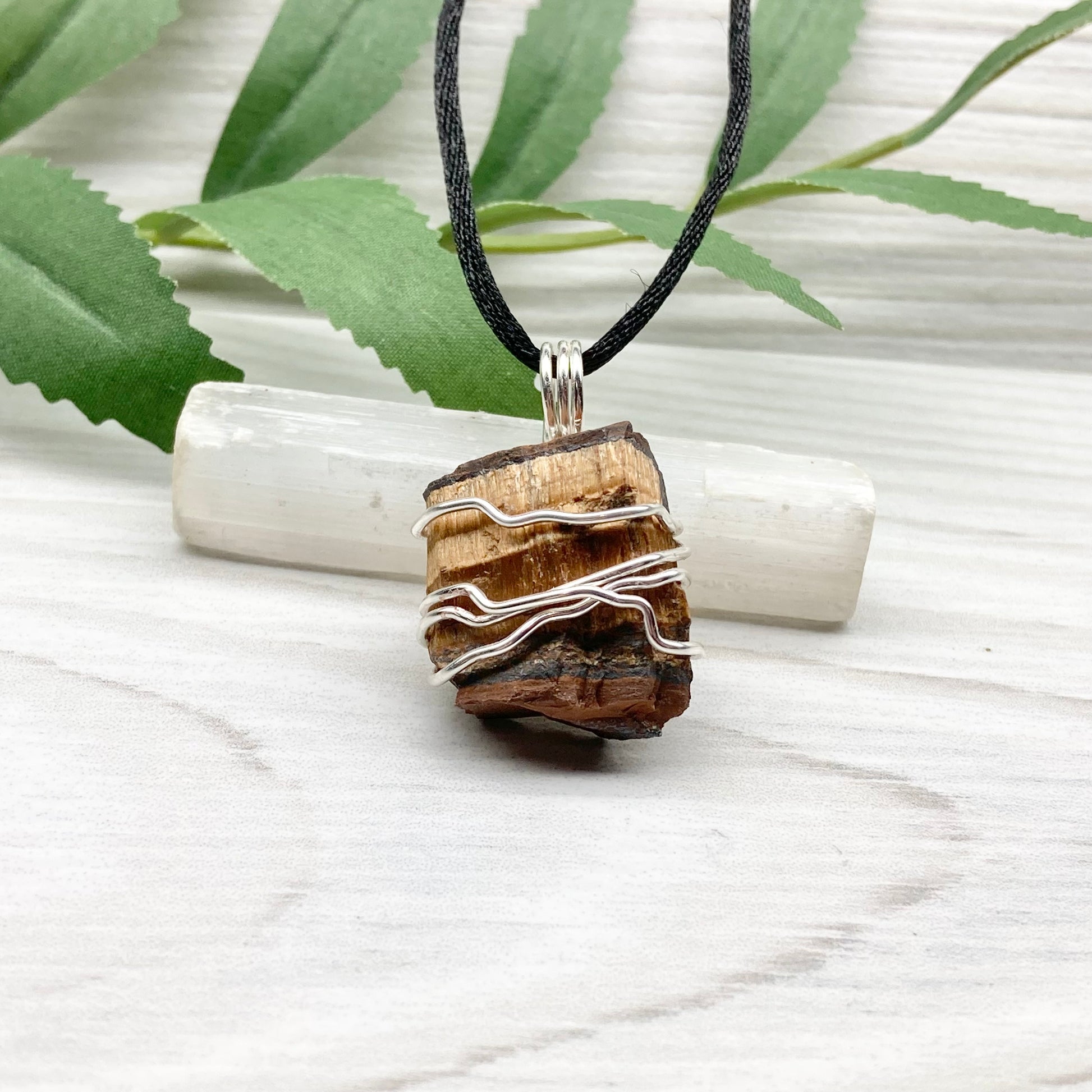 Tigers Eye necklace. Raw Tiger Eye stone wrapped with tarnish resistant silver copper wire. This stone is gold and brown. Unisex handmade pendant. Comes on a black chain with silver ends. Leo zodiac gift. 