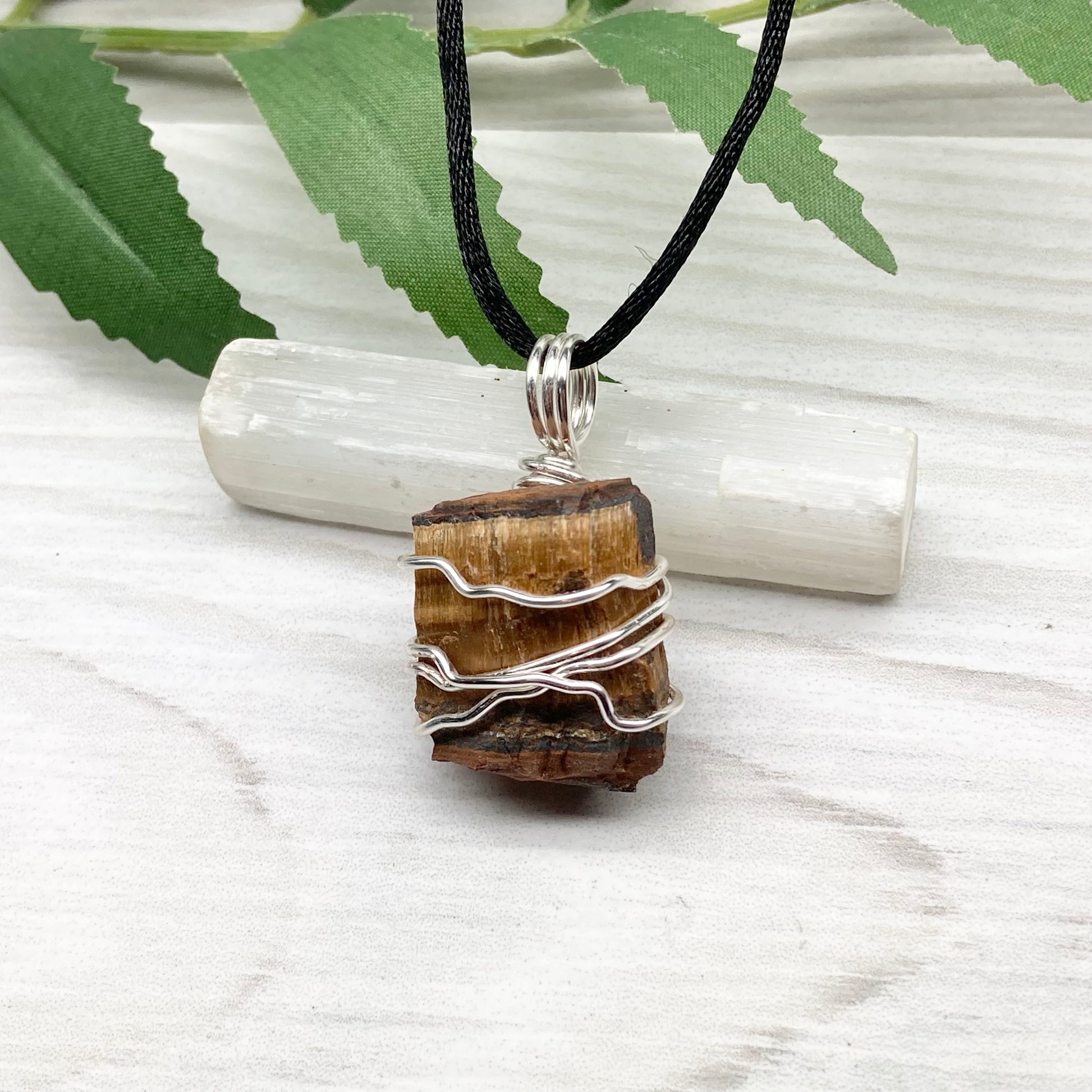 Tigers Eye necklace. Raw Tiger Eye stone wrapped with tarnish resistant silver copper wire. This stone is gold and brown. Unisex handmade pendant. Comes on a black chain with silver ends. Leo zodiac gift. 