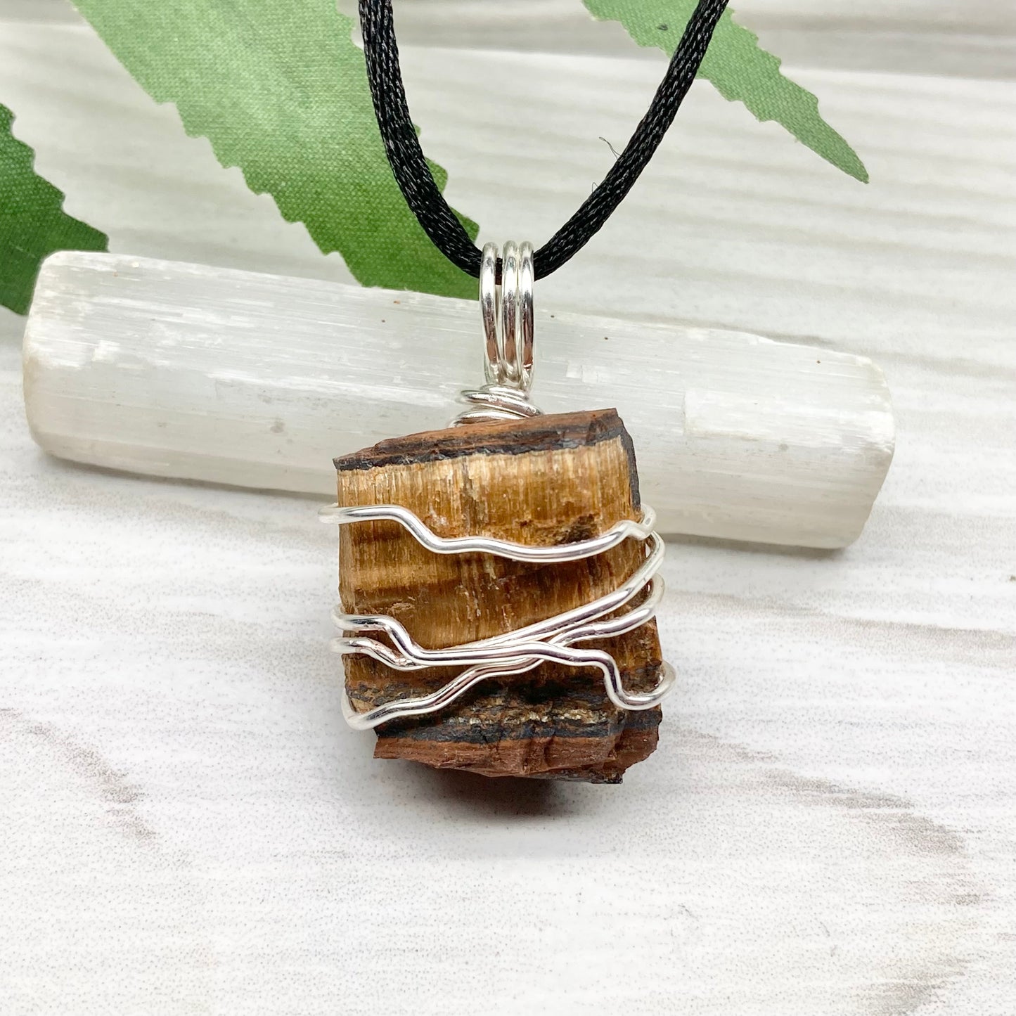 Tigers Eye necklace. Raw Tiger Eye stone wrapped with tarnish resistant silver copper wire. This stone is gold and brown. Unisex handmade pendant. Comes on a black chain with silver ends. Leo zodiac gift. 
