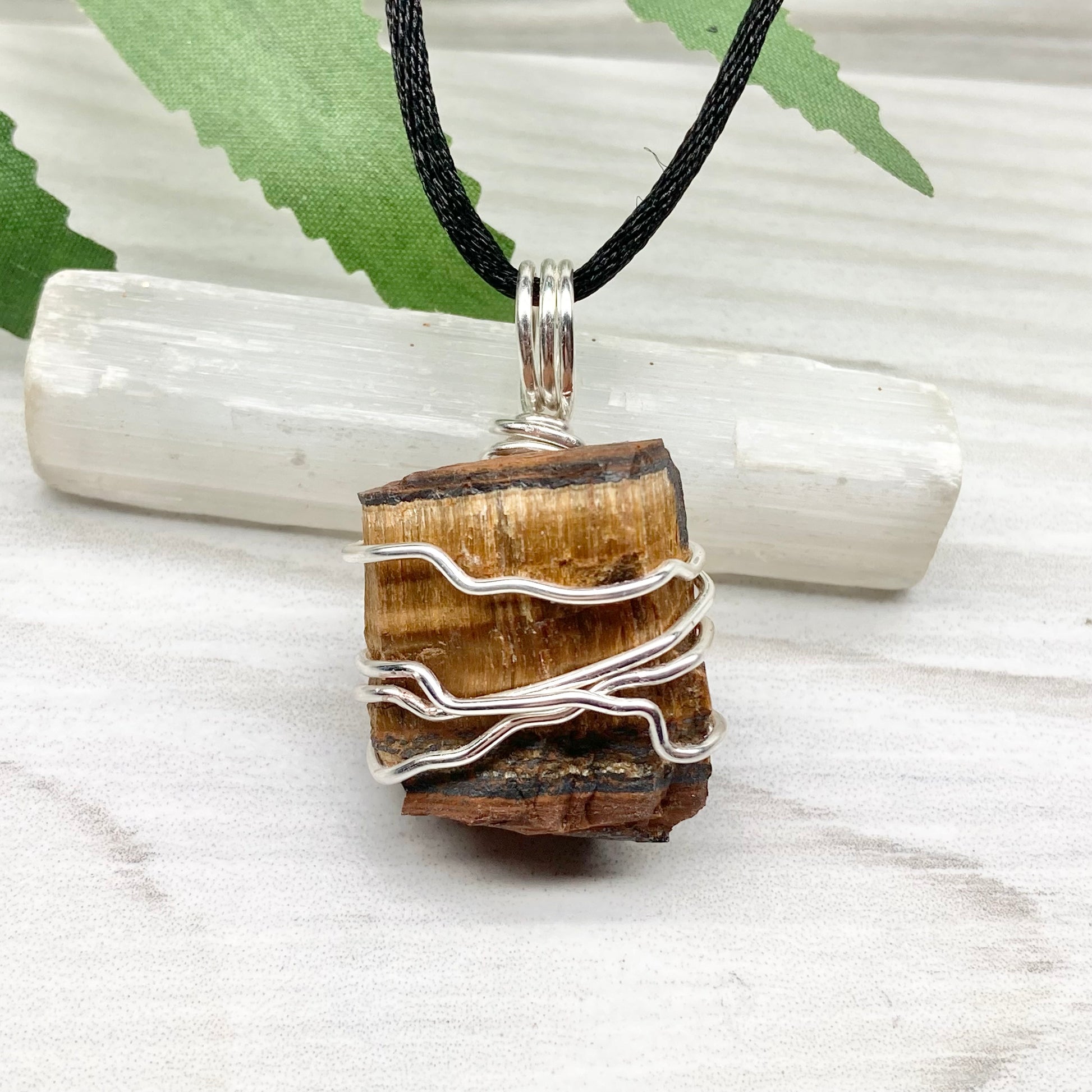 Tigers Eye necklace. Raw Tiger Eye stone wrapped with tarnish resistant silver copper wire. This stone is gold and brown. Unisex handmade pendant. Comes on a black chain with silver ends. Leo zodiac gift. 