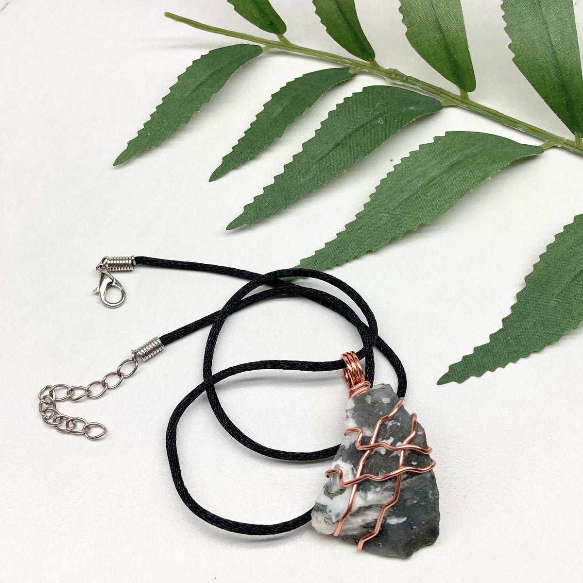 Tree Agate necklace. Green and white stone wrapped with pure copper wire. Hangs on a black chain. Unisex metaphysical jewelry.