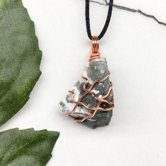 Tree Agate necklace. Green and white stone wrapped with pure copper wire. Hangs on a black chain. Unisex metaphysical jewelry.