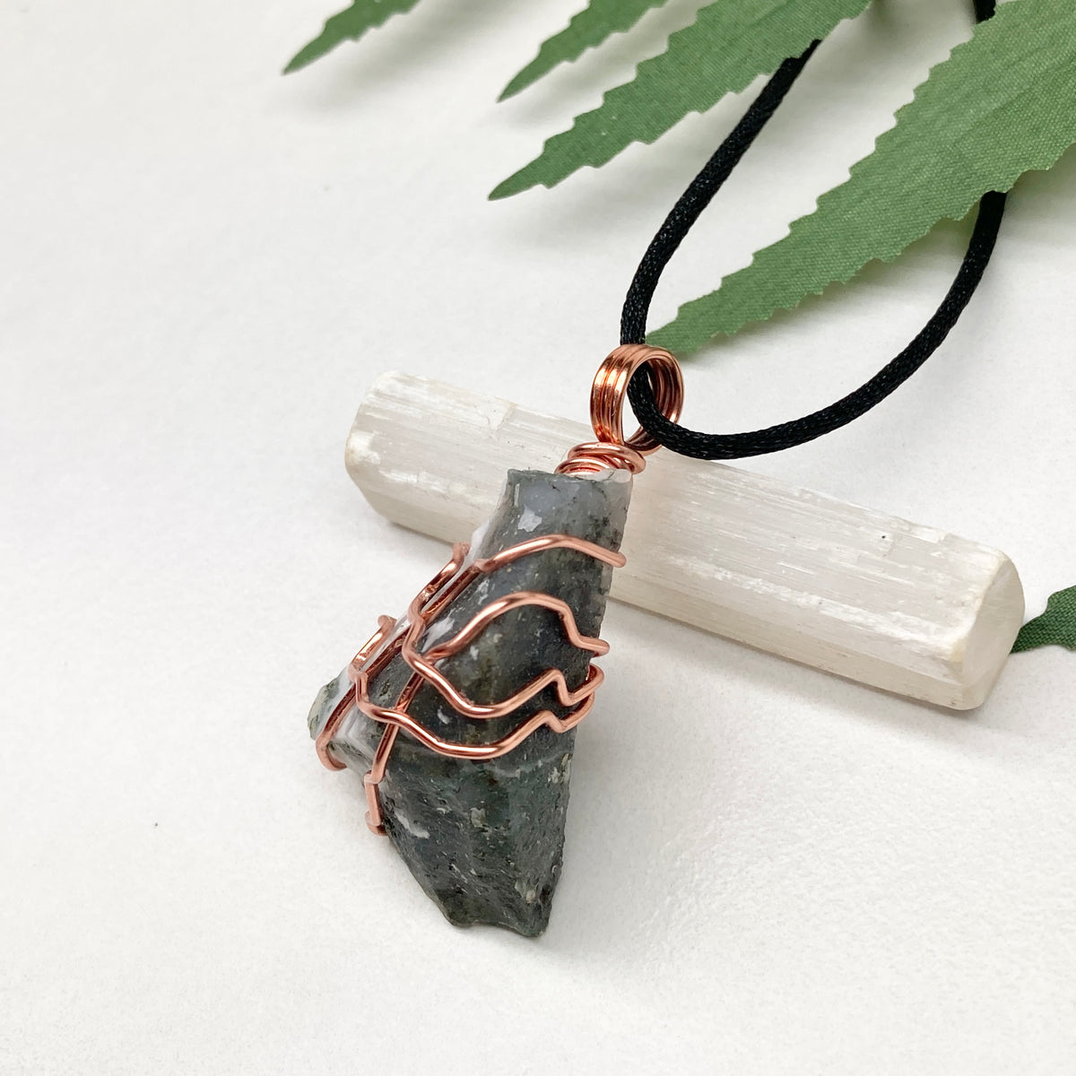 Tree Agate necklace. Green and white stone wrapped with pure copper wire. Hangs on a black chain. Unisex metaphysical jewelry.