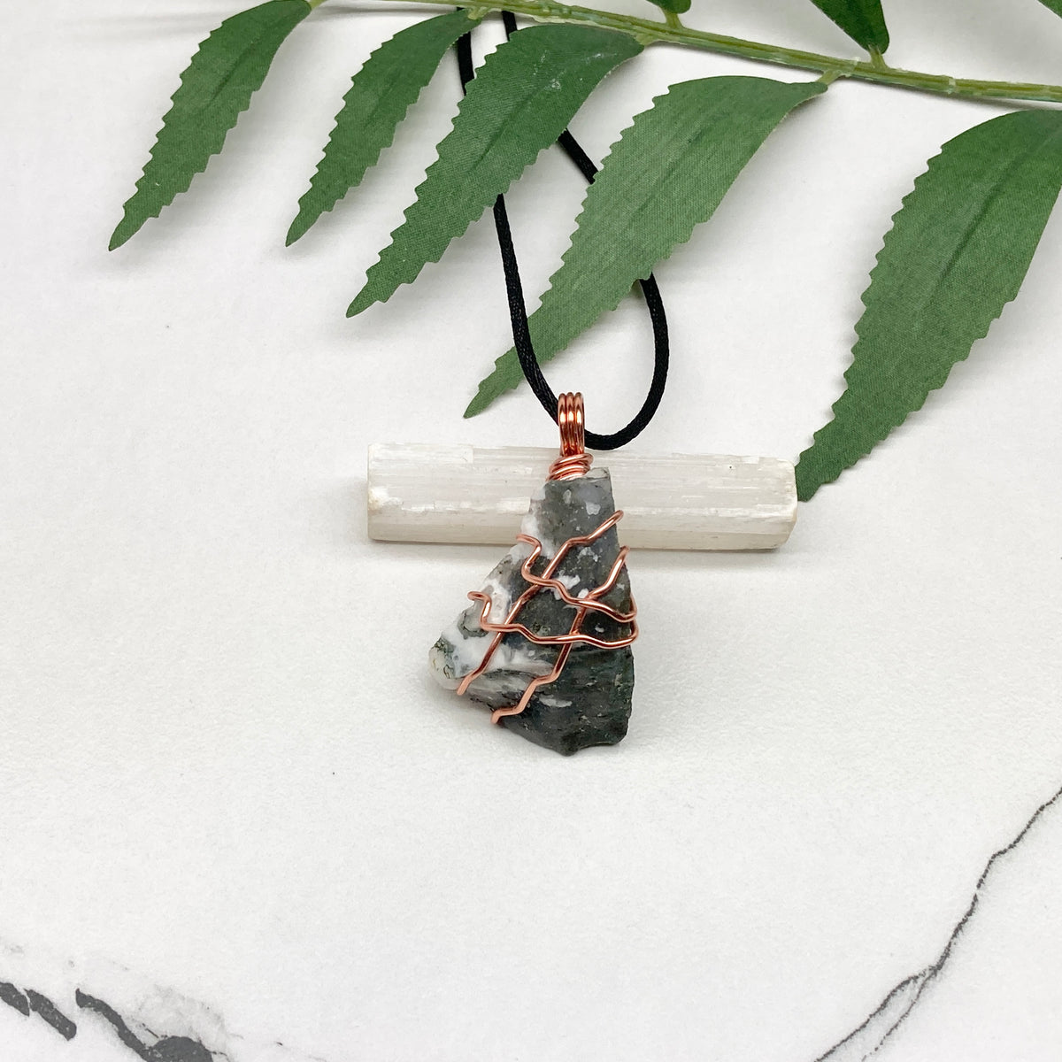 Tree Agate necklace. Green and white stone wrapped with pure copper wire. Hangs on a black chain. Unisex metaphysical jewelry.