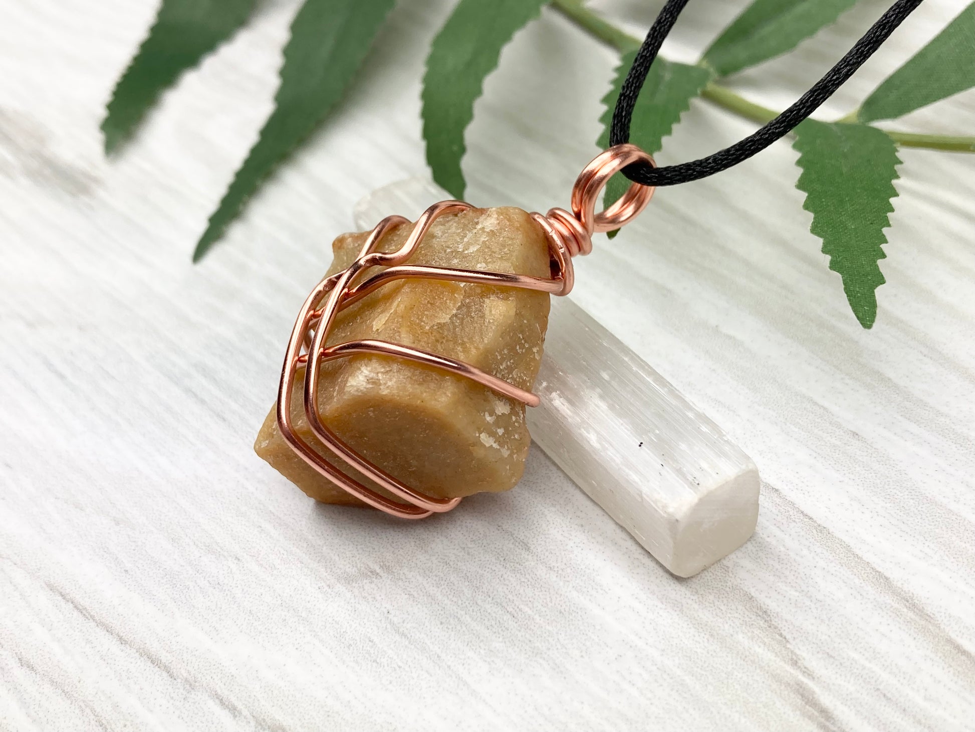 Yellow aventurine necklace. Yellow raw stone wrapped with copper wire. Comes on a black necklace. Handcrafted new age jewelry.