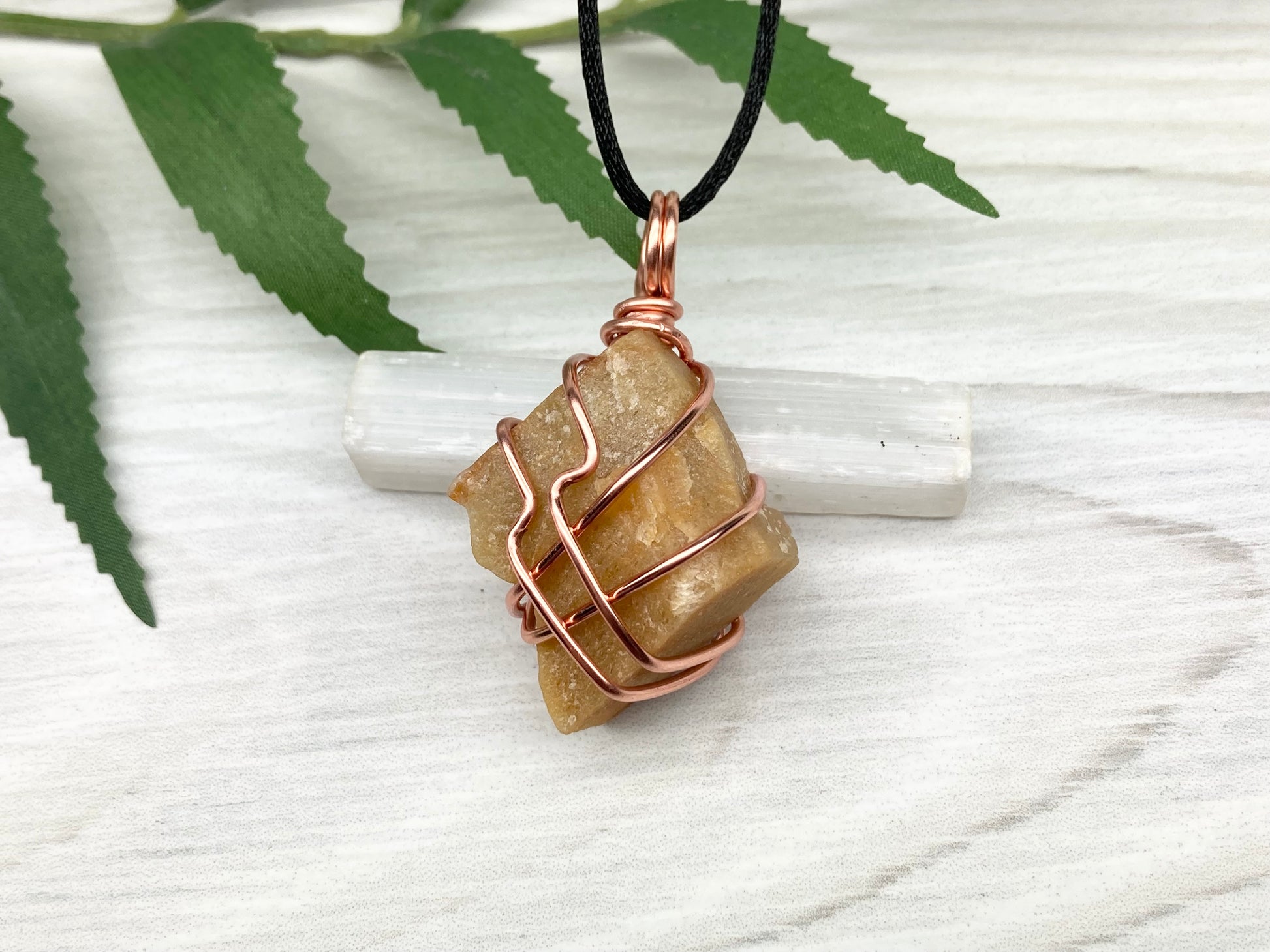 Yellow aventurine necklace. Yellow raw stone wrapped with copper wire. Comes on a black necklace. Handcrafted new age jewelry.
