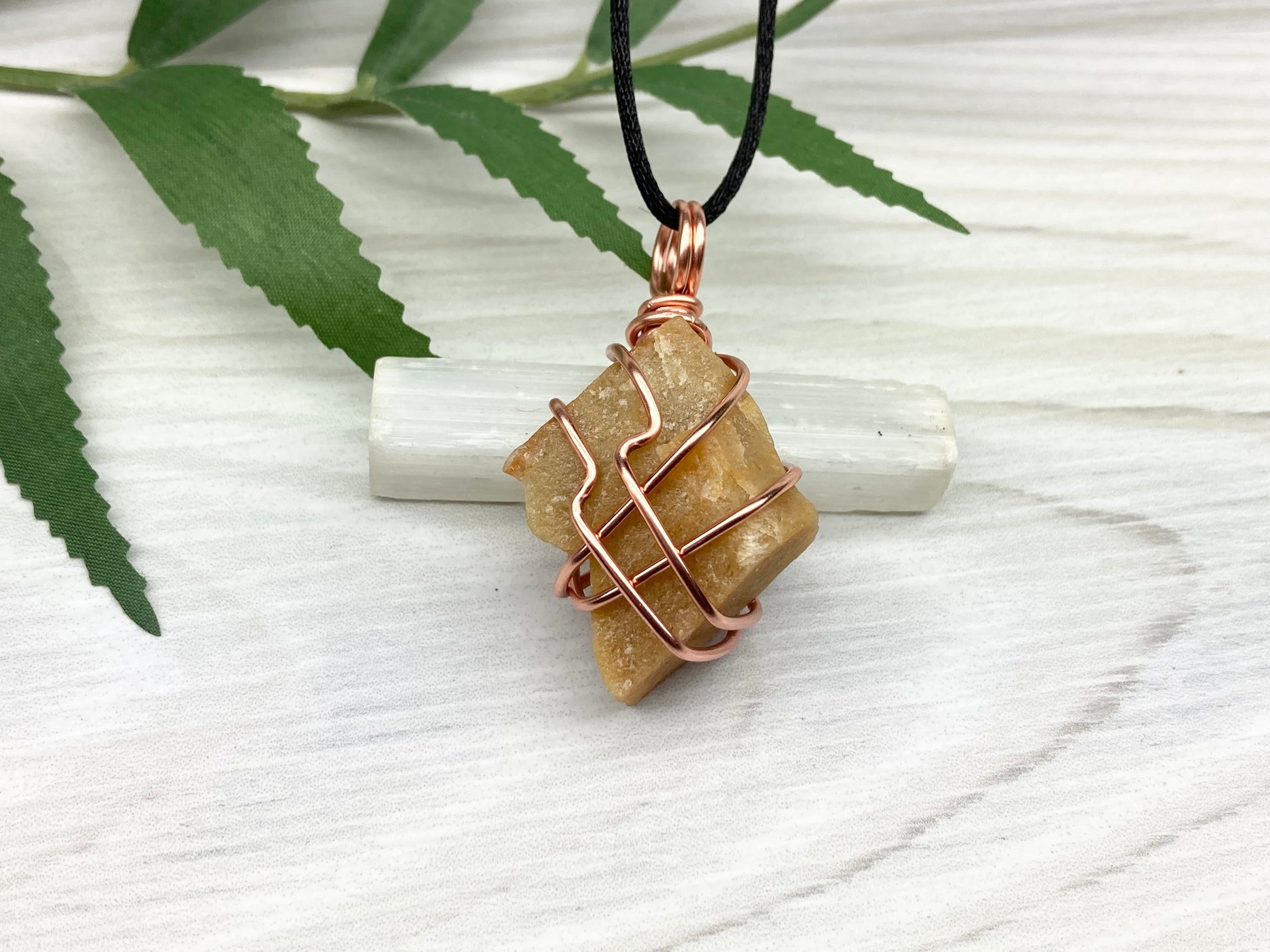 Yellow aventurine necklace. Yellow raw stone wrapped with copper wire. Comes on a black necklace. Handcrafted new age jewelry.