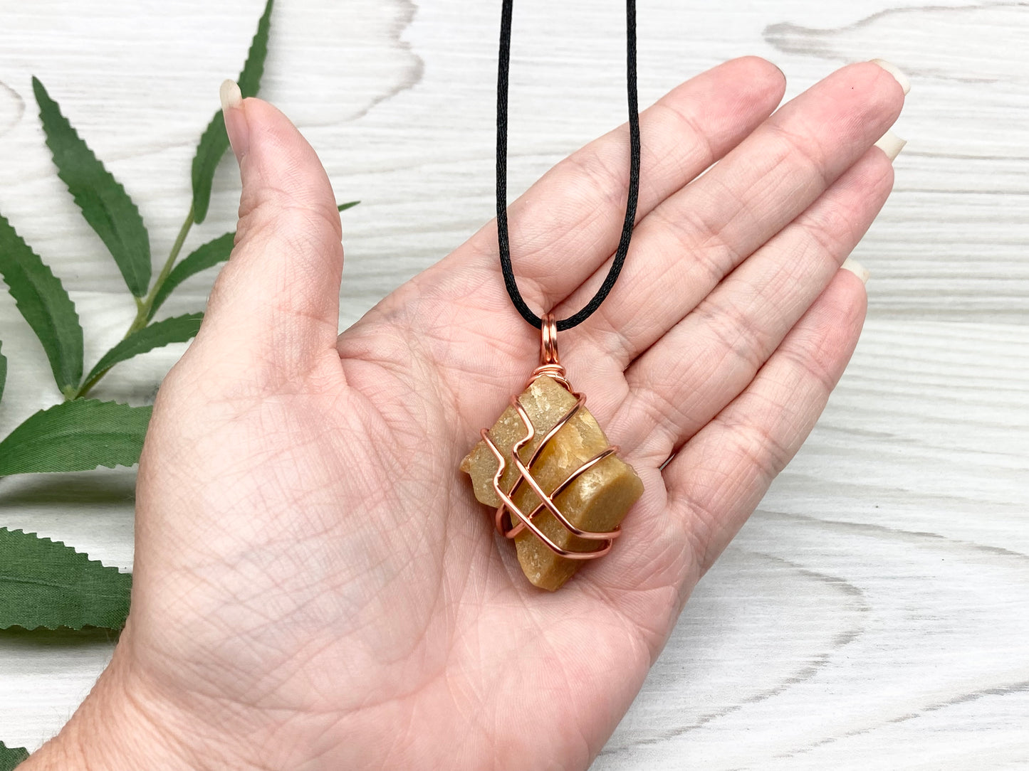 Yellow aventurine necklace. Yellow raw stone wrapped with copper wire. Comes on a black necklace. Handcrafted new age jewelry.