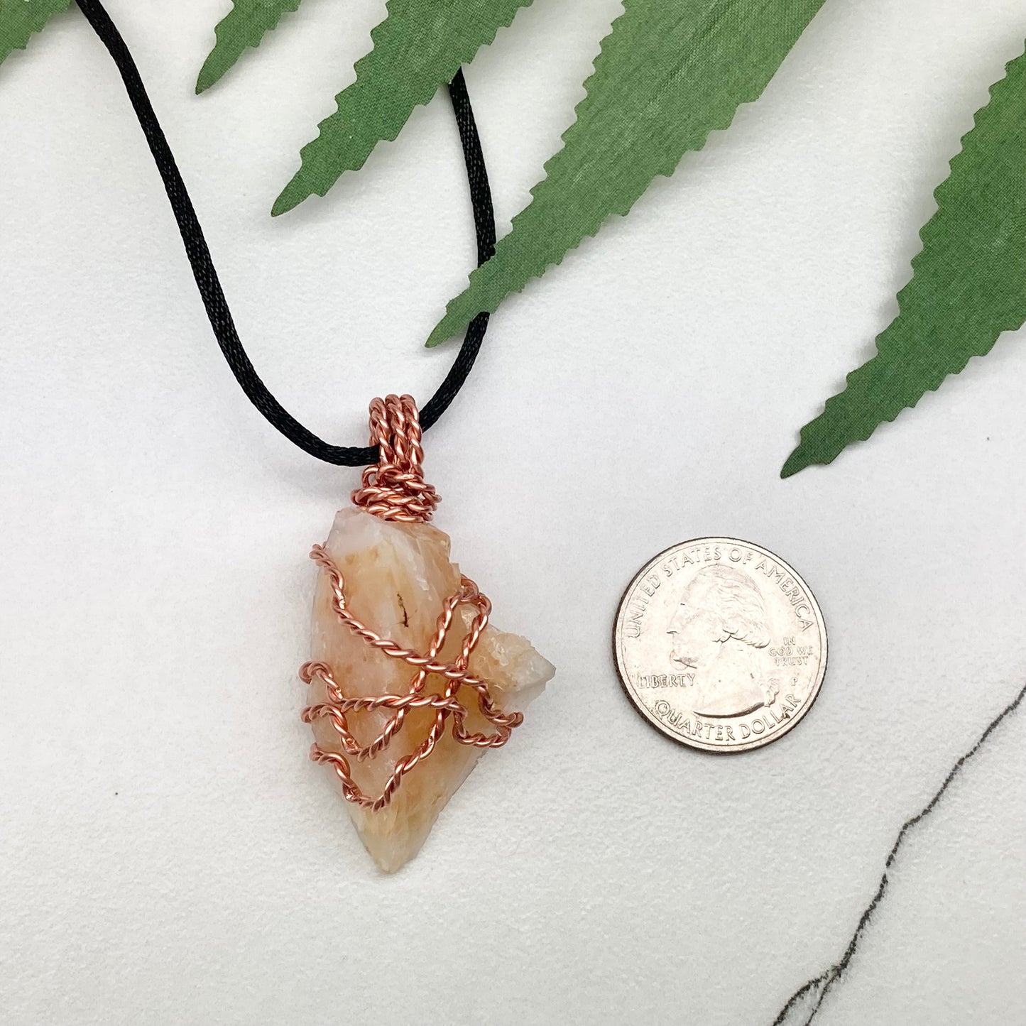 Yellow Opal necklace. Raw yellow stone wrapped with pure copper wire. Hangs on a black chain.