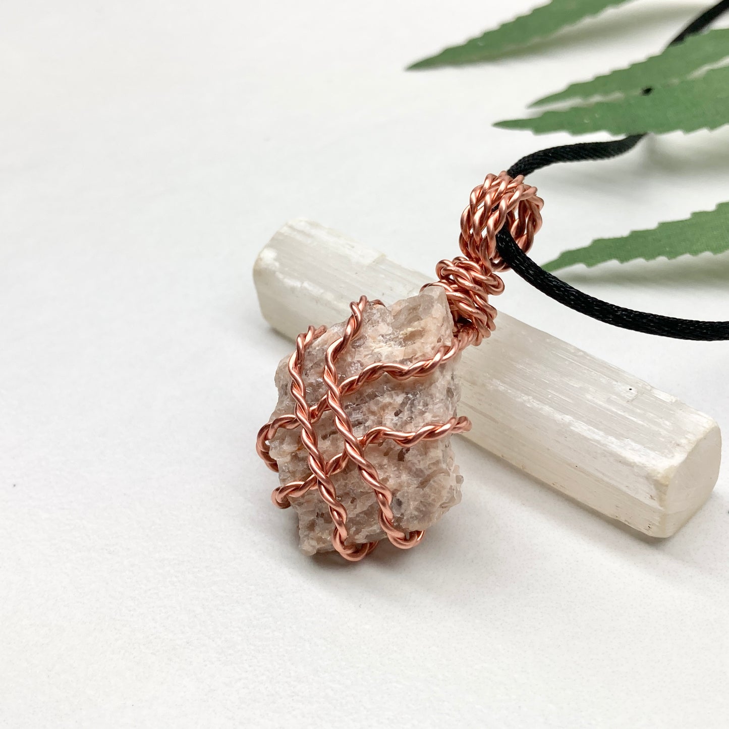 Zebradorite necklace. Raw beige stone wrapped with pure copper wire. Hangs on a black chain. Handmade metaphysical jewelry.