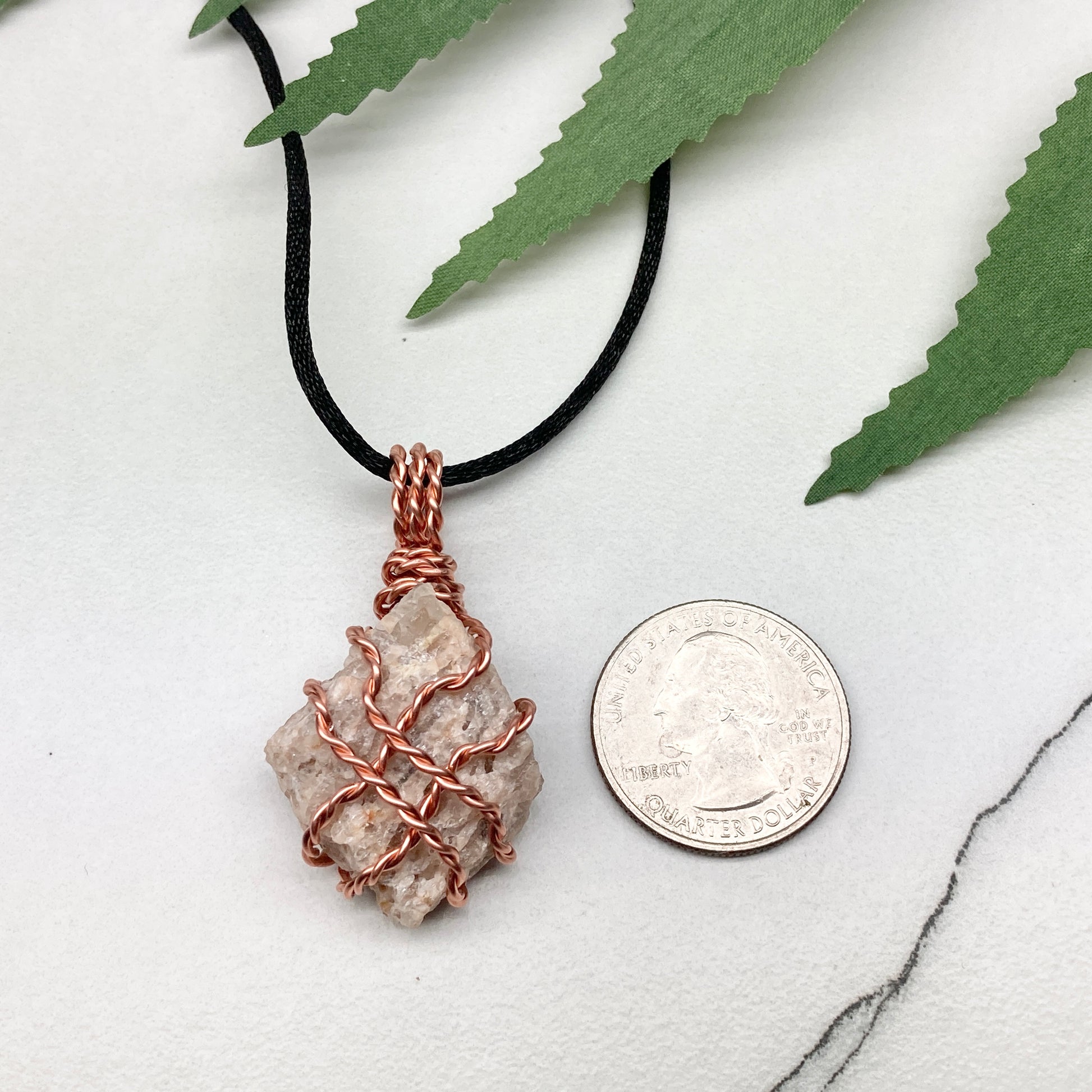 Zebradorite necklace. Raw beige stone wrapped with pure copper wire. Hangs on a black chain. Handmade metaphysical jewelry.