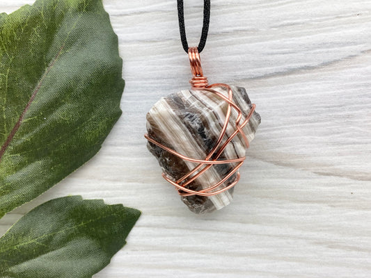 Chunky Phantom Calcite Necklace. Also Known As Zebra Calcite. Copper Wrapped Striped Calcite Pendant. Raw Natural Rough Crystal. Comes On A Black Necklace. New Age Jewelry. 