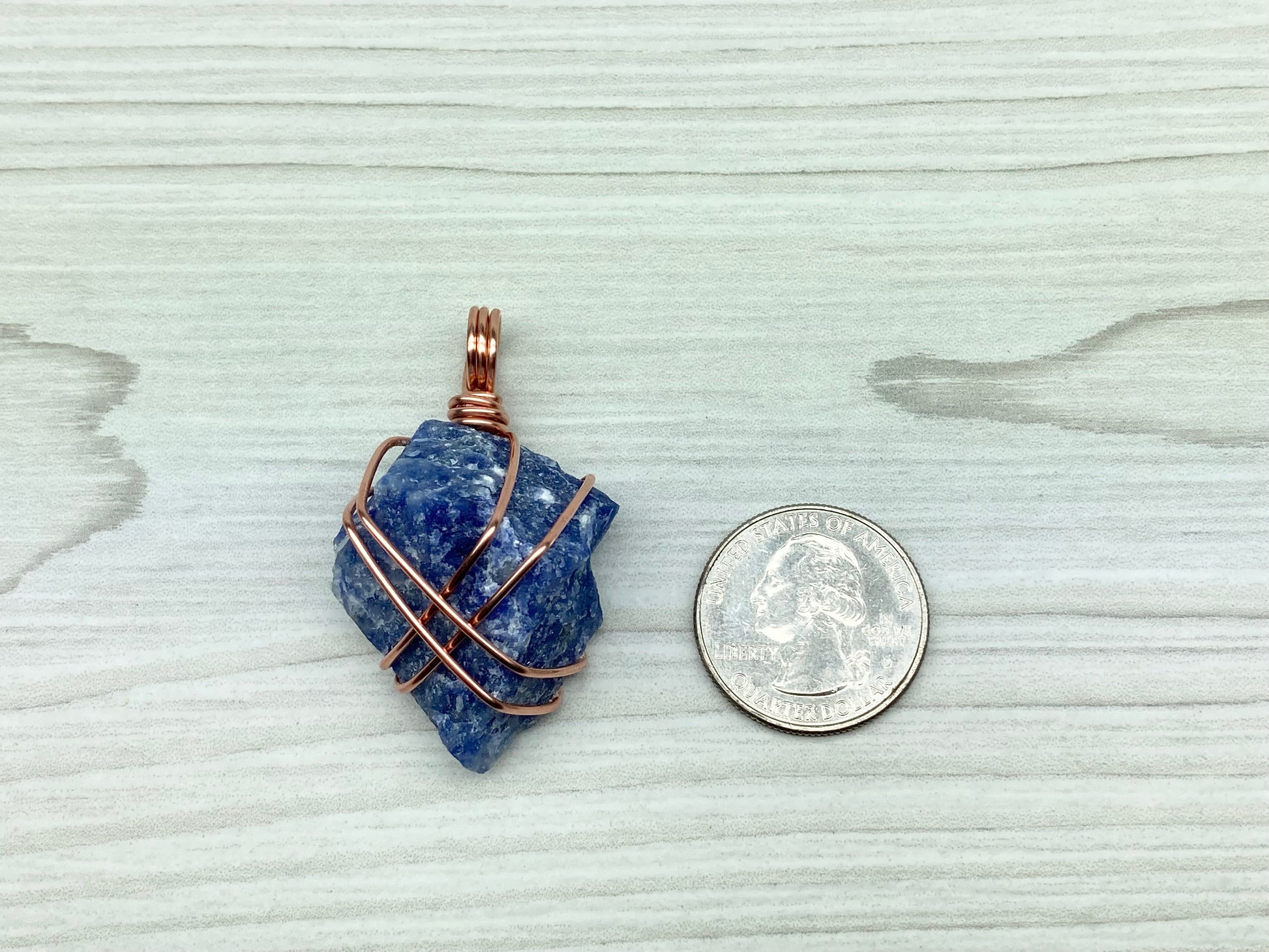 Raw Sodalite Necklace. Real Sodalite Crystal Hand Wrapped With Pure Copper Wire. Gemstone Is Blue With White In It. Comes On A Black Chain. Sagittarius Zodiac Stone Unisex Jewelry. Pendant Measures 2.3 X 1 Inches.