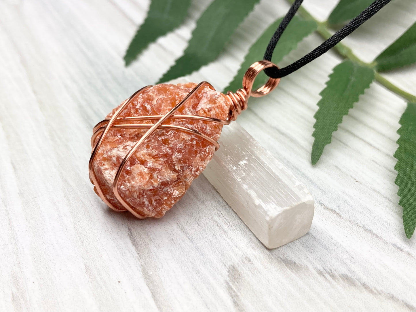 Raw Orange Calcite Necklace. Natural Orange Crystal Hand Wrapped With Copper Wire. Comes On A Black Chain. Leo Zodiac Stone Pendant. New Age Metaphysical Jewelry. Fire Element Gemstone.