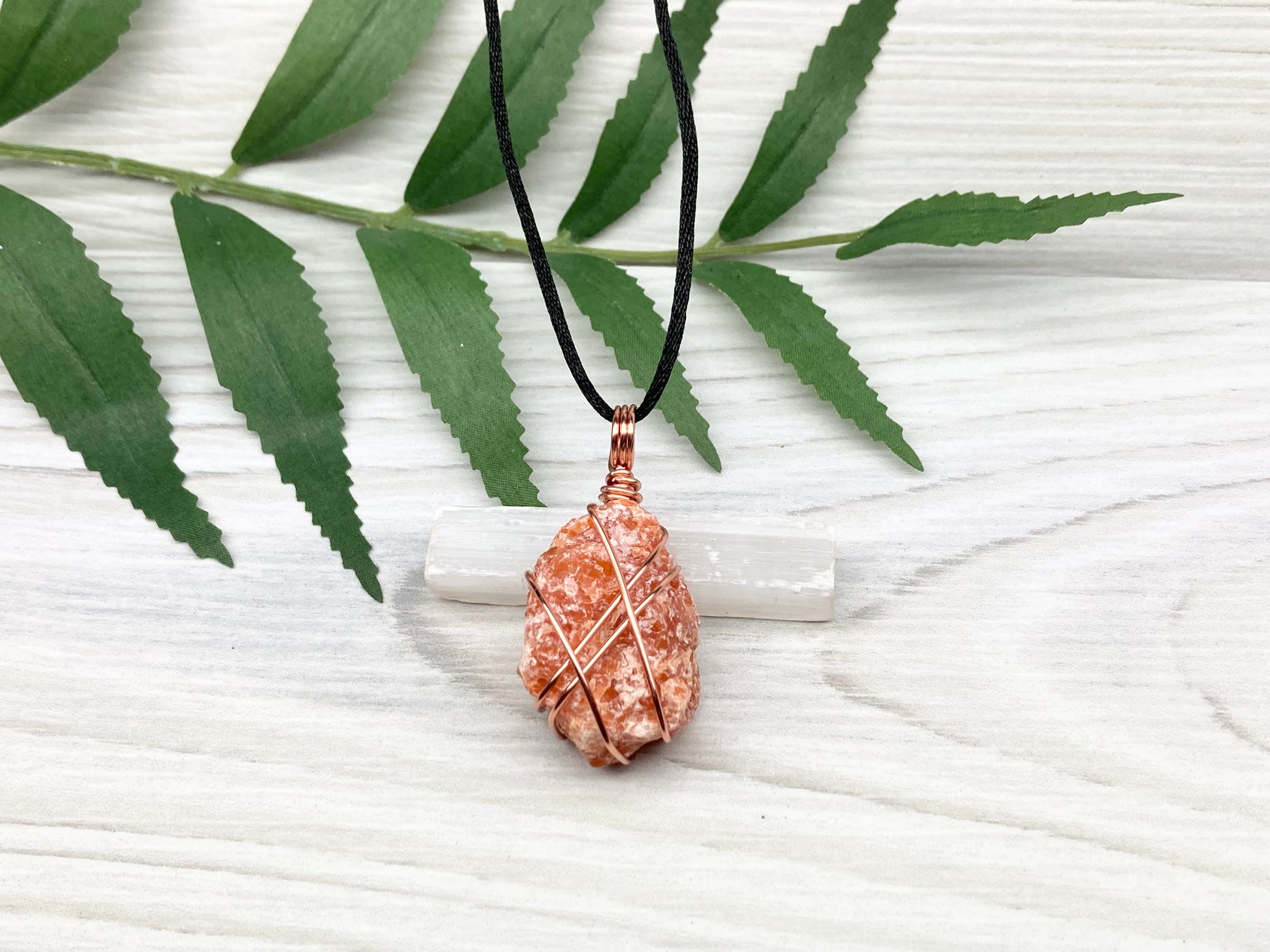 Raw Orange Calcite Necklace. Natural Orange Crystal Hand Wrapped With Copper Wire. Comes On A Black Chain. Leo Zodiac Stone Pendant. New Age Metaphysical Jewelry. Fire Element Gemstone.
