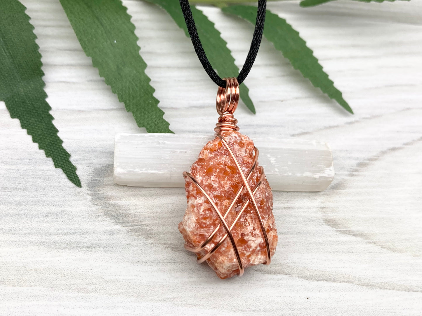 Raw Orange Calcite Necklace. Natural Orange Crystal Hand Wrapped With Copper Wire. Comes On A Black Chain. Leo Zodiac Stone Pendant. New Age Metaphysical Jewelry. Fire Element Gemstone.