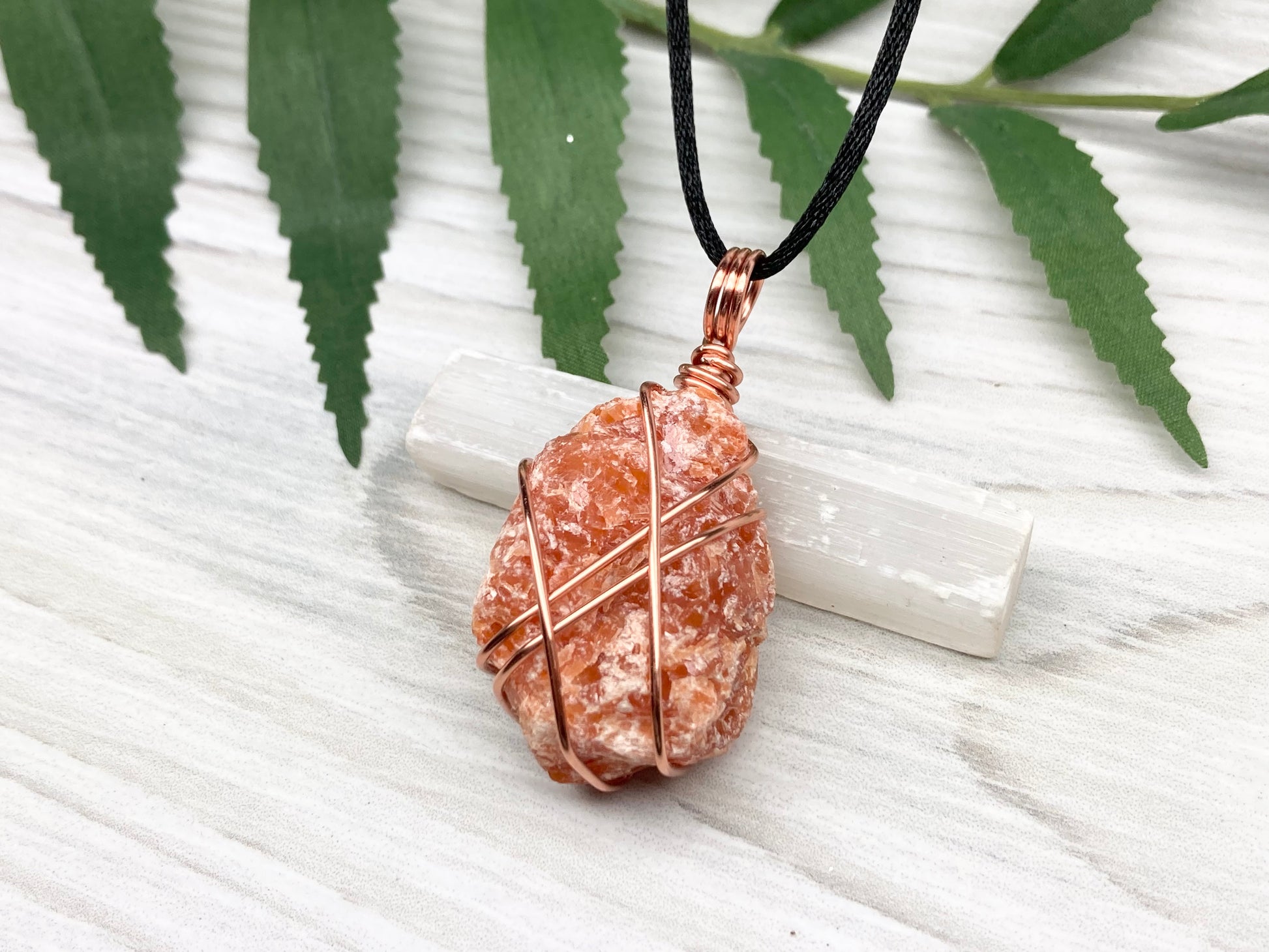 Raw Orange Calcite Necklace. Natural Orange Crystal Hand Wrapped With Copper Wire. Comes On A Black Chain. Leo Zodiac Stone Pendant. New Age Metaphysical Jewelry. Fire Element Gemstone.