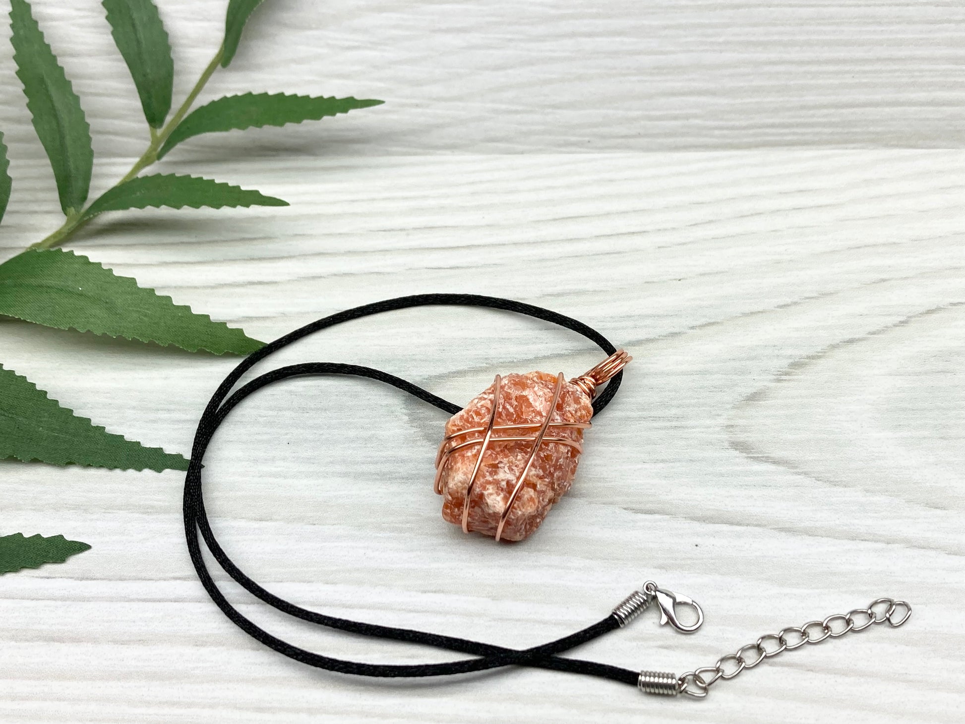 Raw Orange Calcite Necklace. Natural Orange Crystal Hand Wrapped With Copper Wire. Comes On A Black Chain. Leo Zodiac Stone Pendant. New Age Metaphysical Jewelry. Fire Element Gemstone.