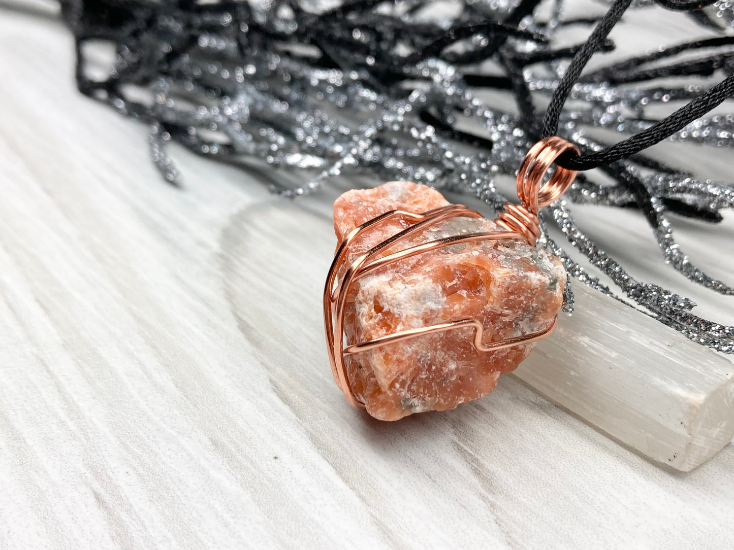 Natural Raw Orange Calcite Crystal Hand Wrapped With Tarnish Resistant Copper Wire. Comes On A Black Chain. Crystal Is Orange With A Bit Of Blue On The Top.Pendant Handcrafted During The Moon In Sagittarius. New Age Style Jewelry.