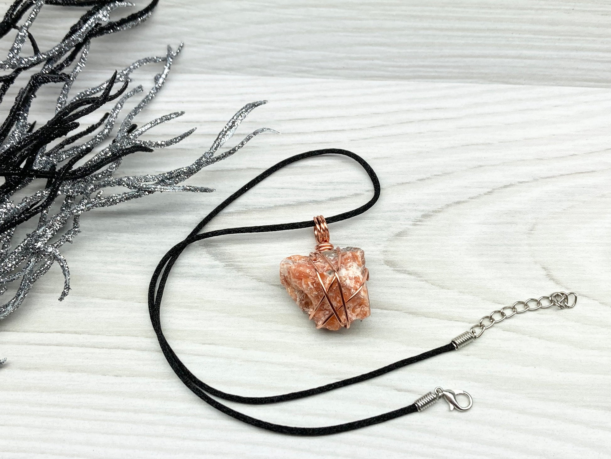Natural Raw Orange Calcite Crystal Hand Wrapped With Tarnish Resistant Copper Wire. Comes On A Black Chain. Crystal Is Orange With A Bit Of Blue On The Top.Pendant Handcrafted During The Moon In Sagittarius. New Age Style Jewelry.