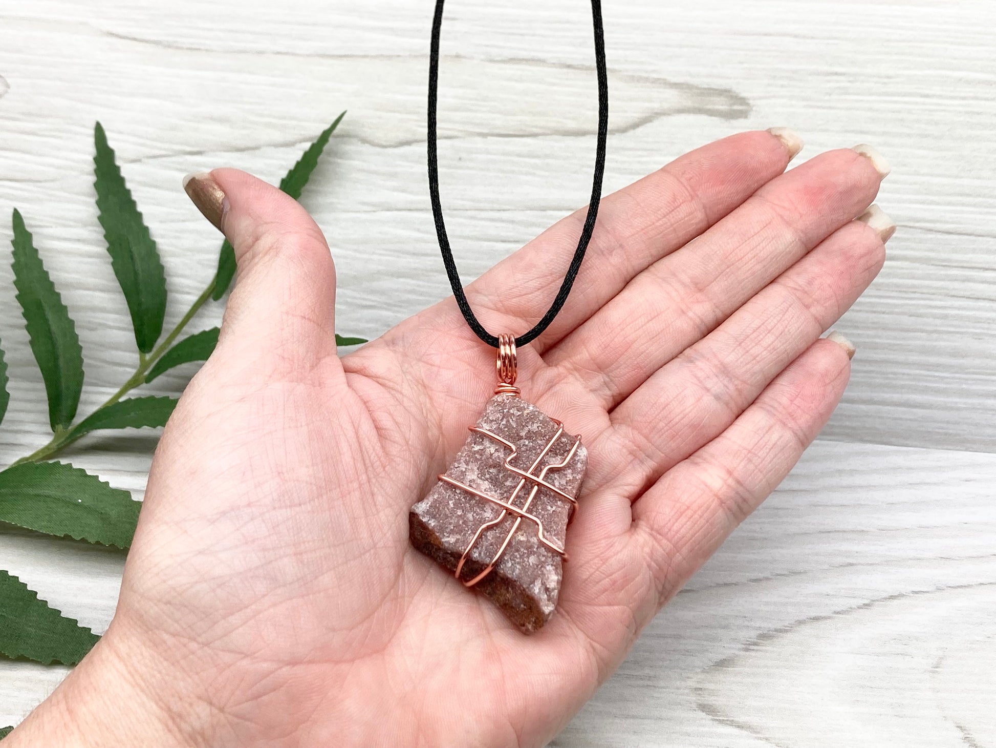Raw Guava Quartz Necklace. Guava Quartz Crystal Wrapped With Tarnish Resistant Copper Wire. Reddish Brown Stone Pendant. Comes On A Black Chain. Aquarius Zodiac Crystal. Spiritual New Age Jewelry. Pendant Measures 2.1 H X 1.3 Inches W. 
